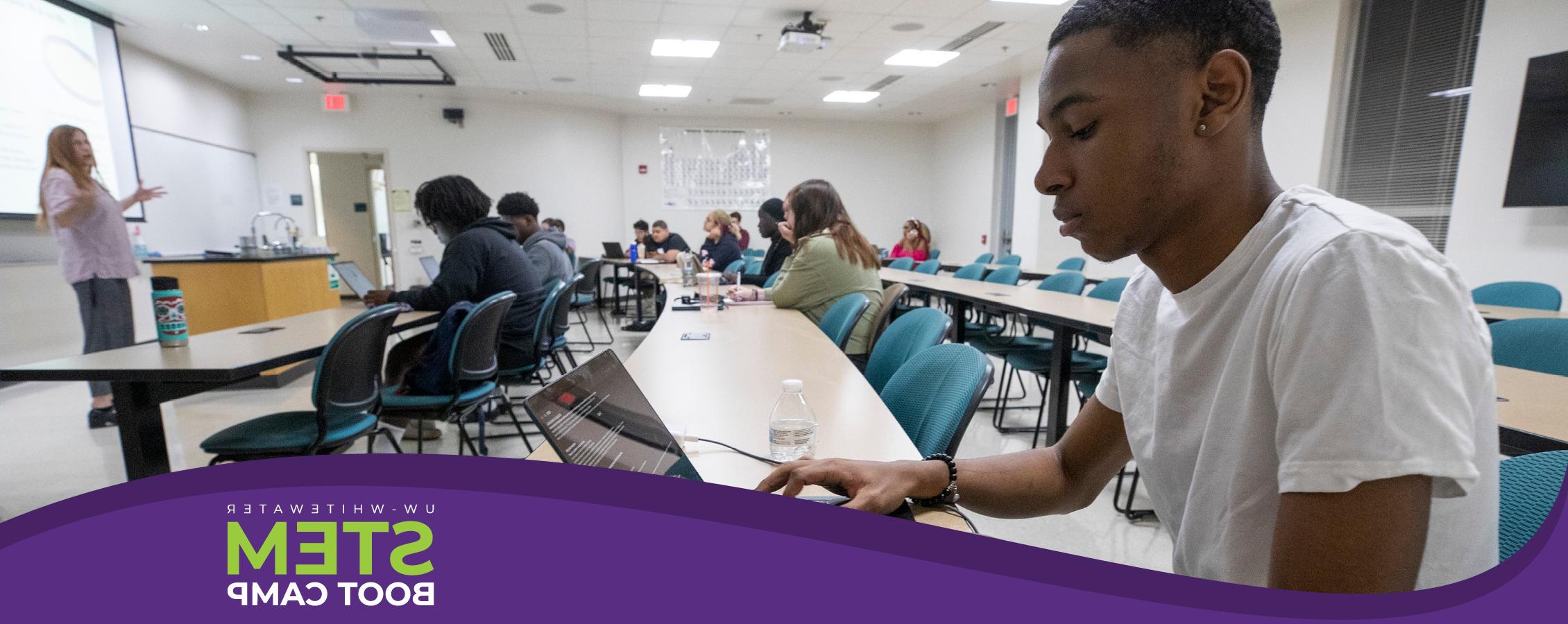 A student works on a computer during class.