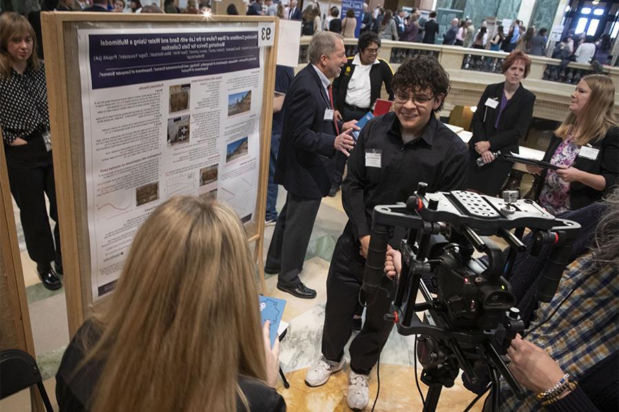 A student presents for undergraduate research at the Wisconsin State Capitol.