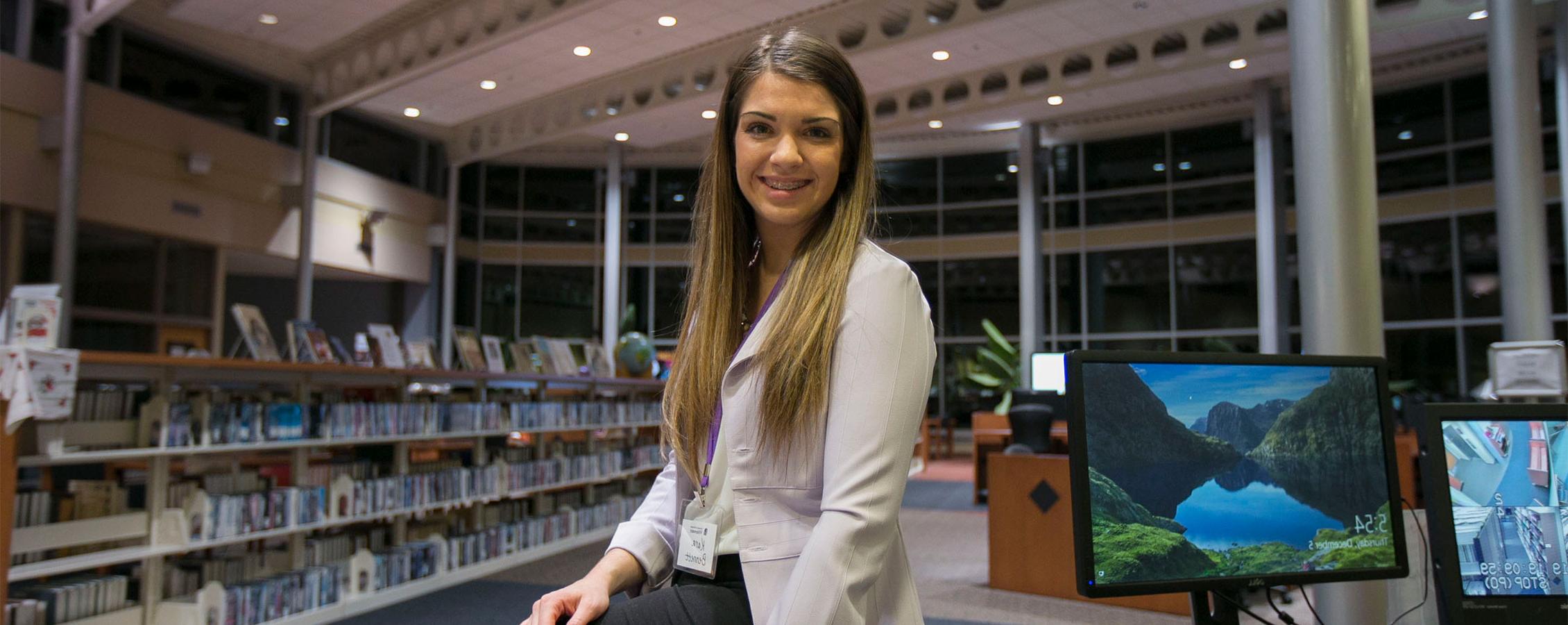 A student sits in the UW-Rock County library.