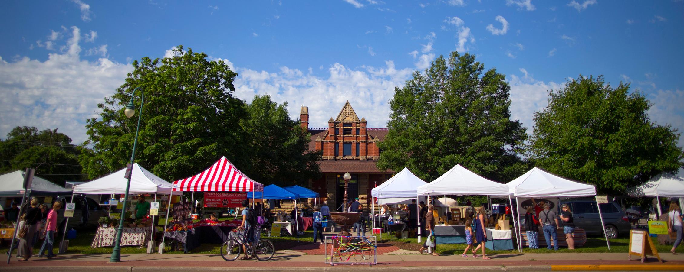 Colorful pop up tents line Whitewater's downtown area for the City Market.