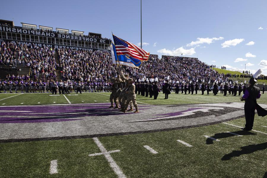 The Marching Band performs in front of a large crowd at Perkins Stadium.