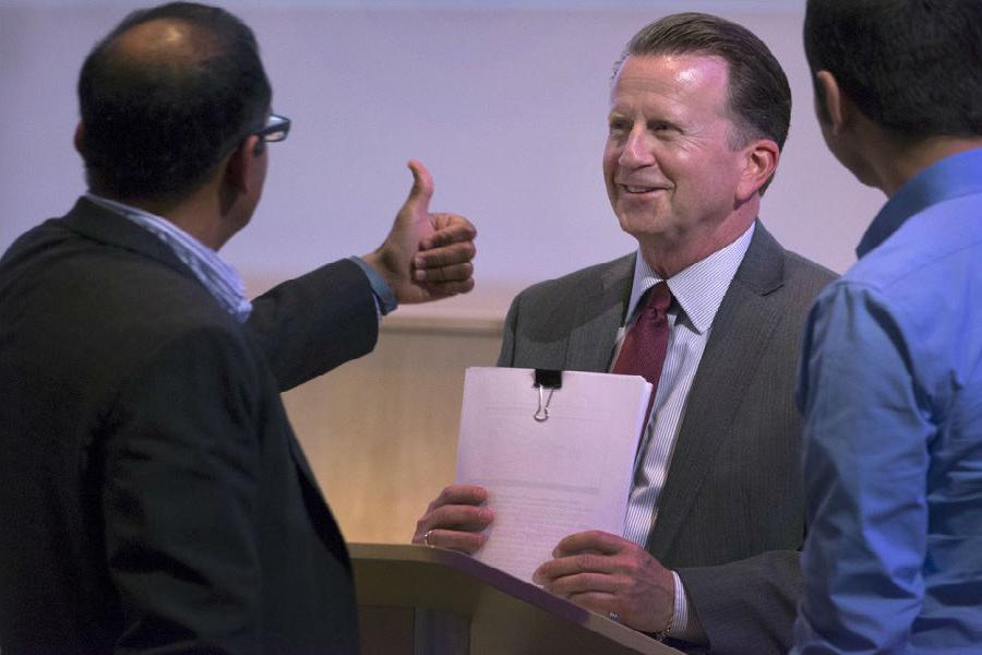 Doctor of Business Administration program director Praveen Parboteeah, right, gives a “thumbs up” to Stephen Gray immediately following Gray’s dissertation defense. (足彩平台 photo/Craig Schreiner)