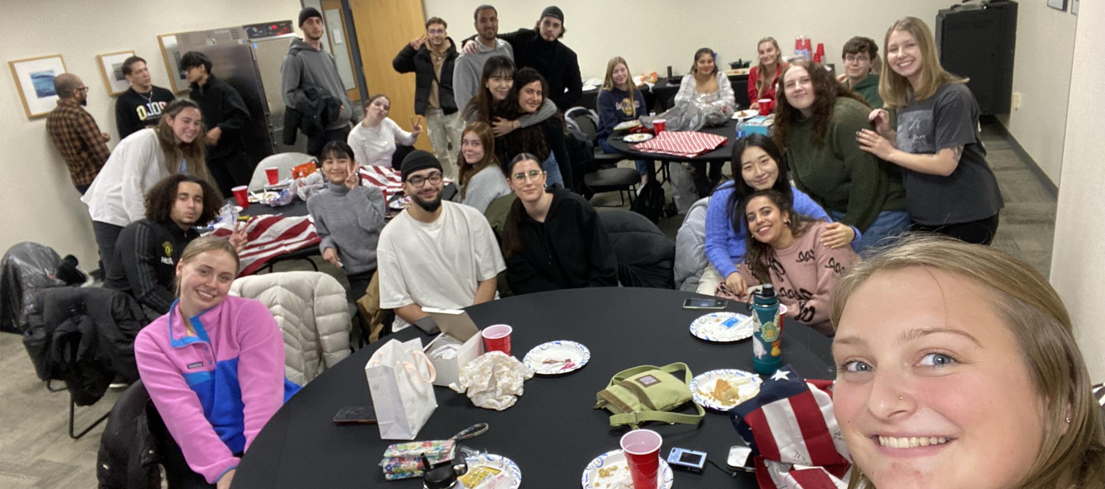 A group of international students pose for a photo in the University Center.