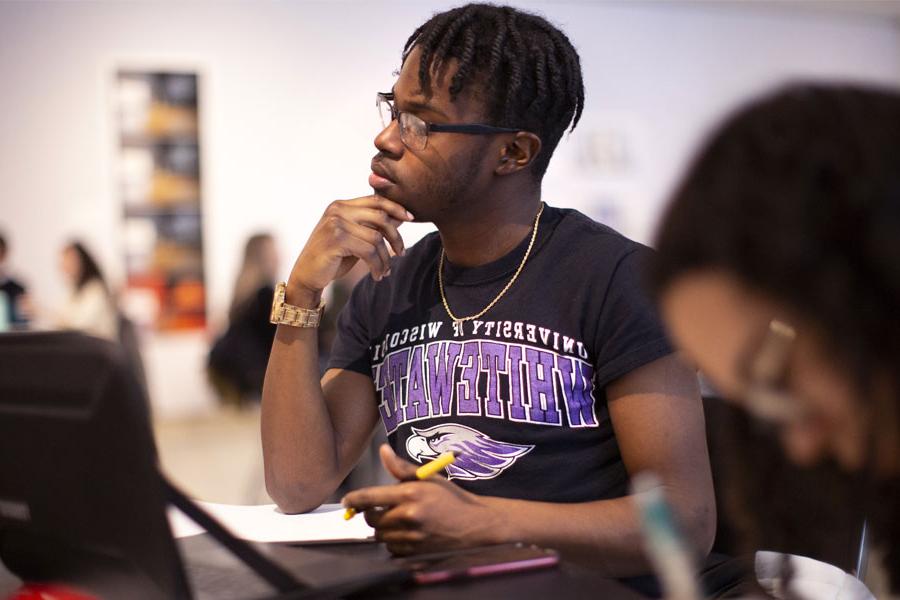 Students listening in a classroom.