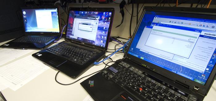 Three laptops on a desk