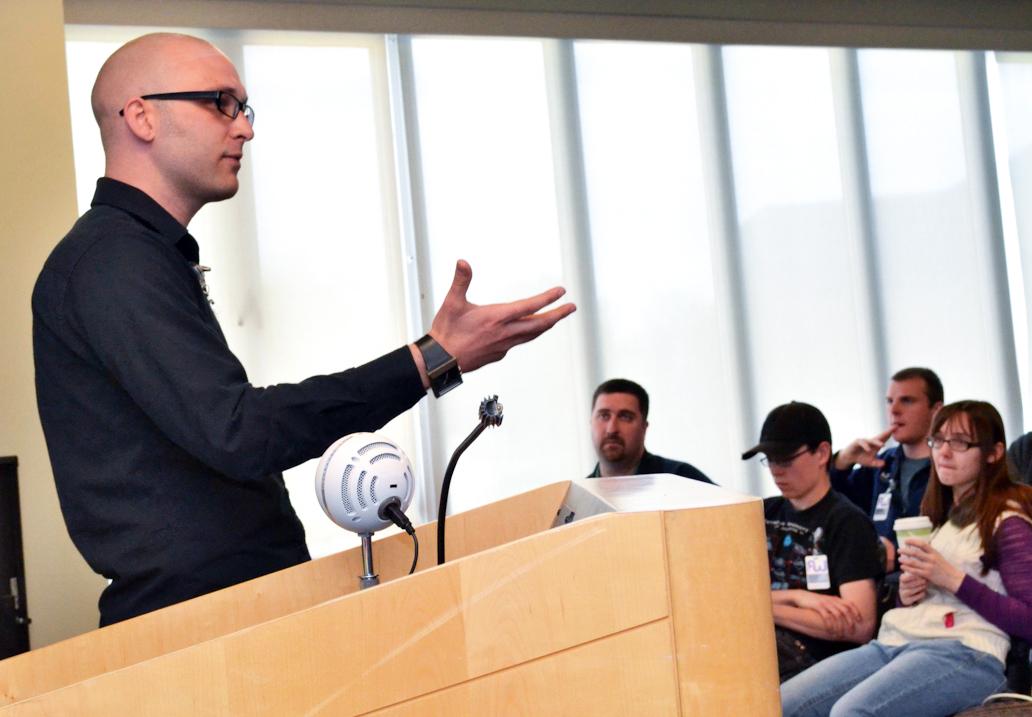 Man at a podium talking to an audience