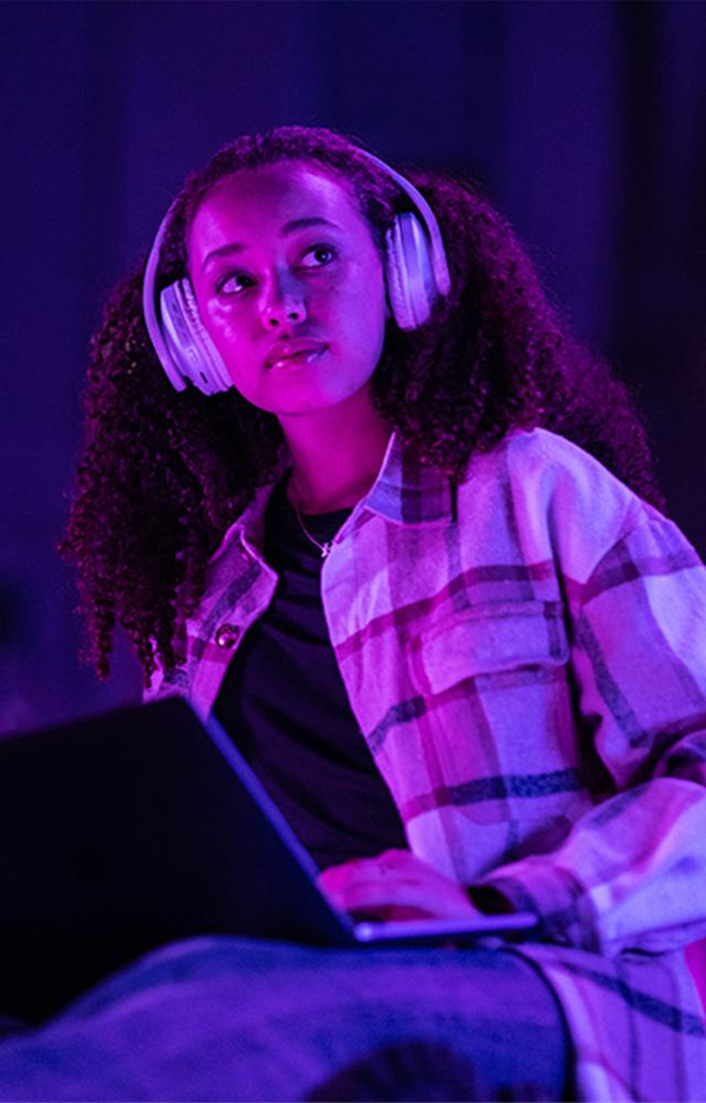 Young woman reads tablet taking online college class